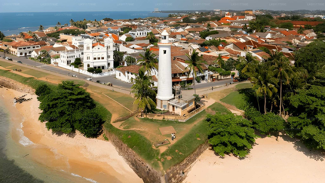 Lighthouse on a coastal town with beach and ocean view
